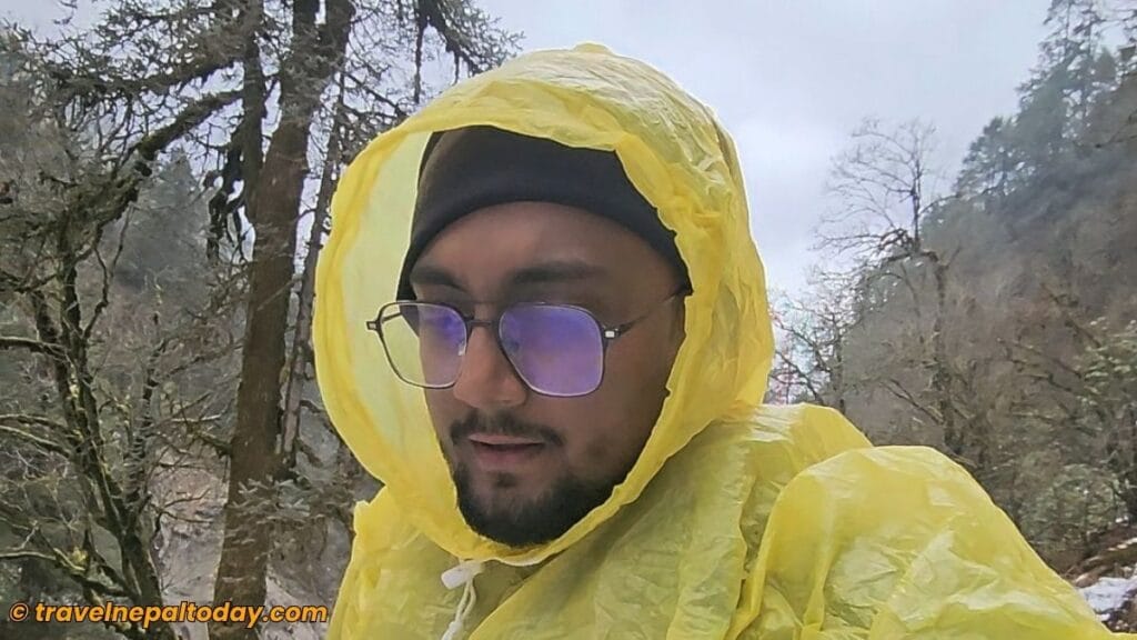 wearing raincoat in panch pokhari trek