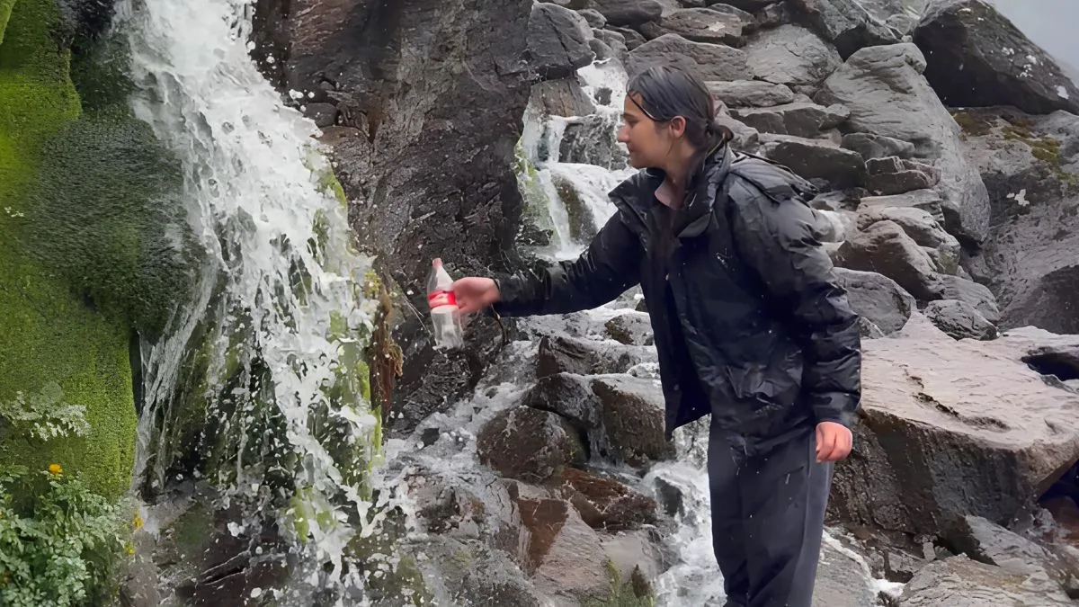 filling water bottle in high altitude place